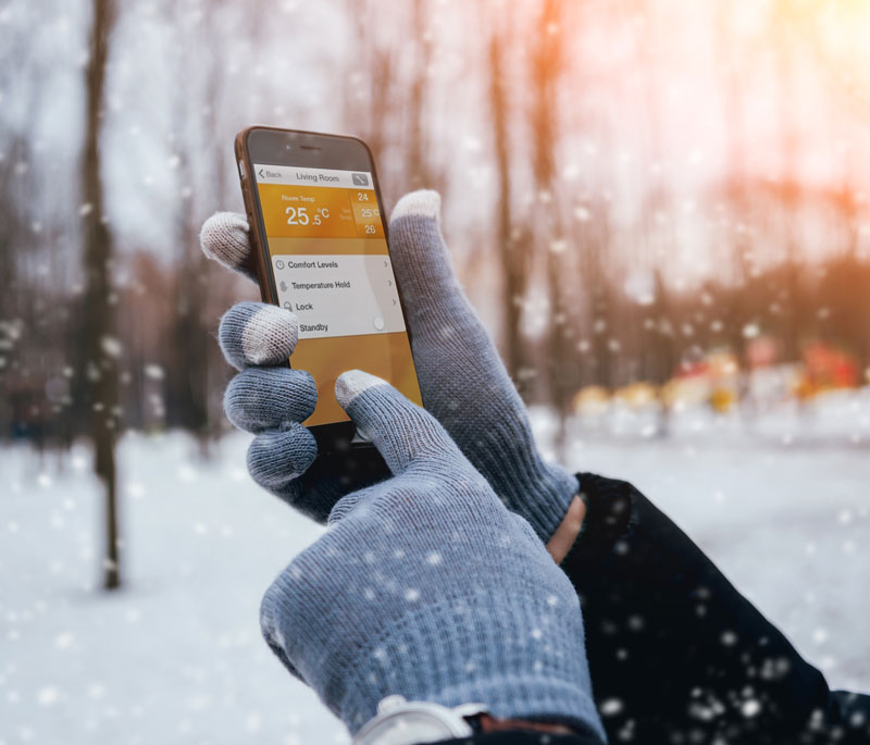 Man Controlling Heating From Phone