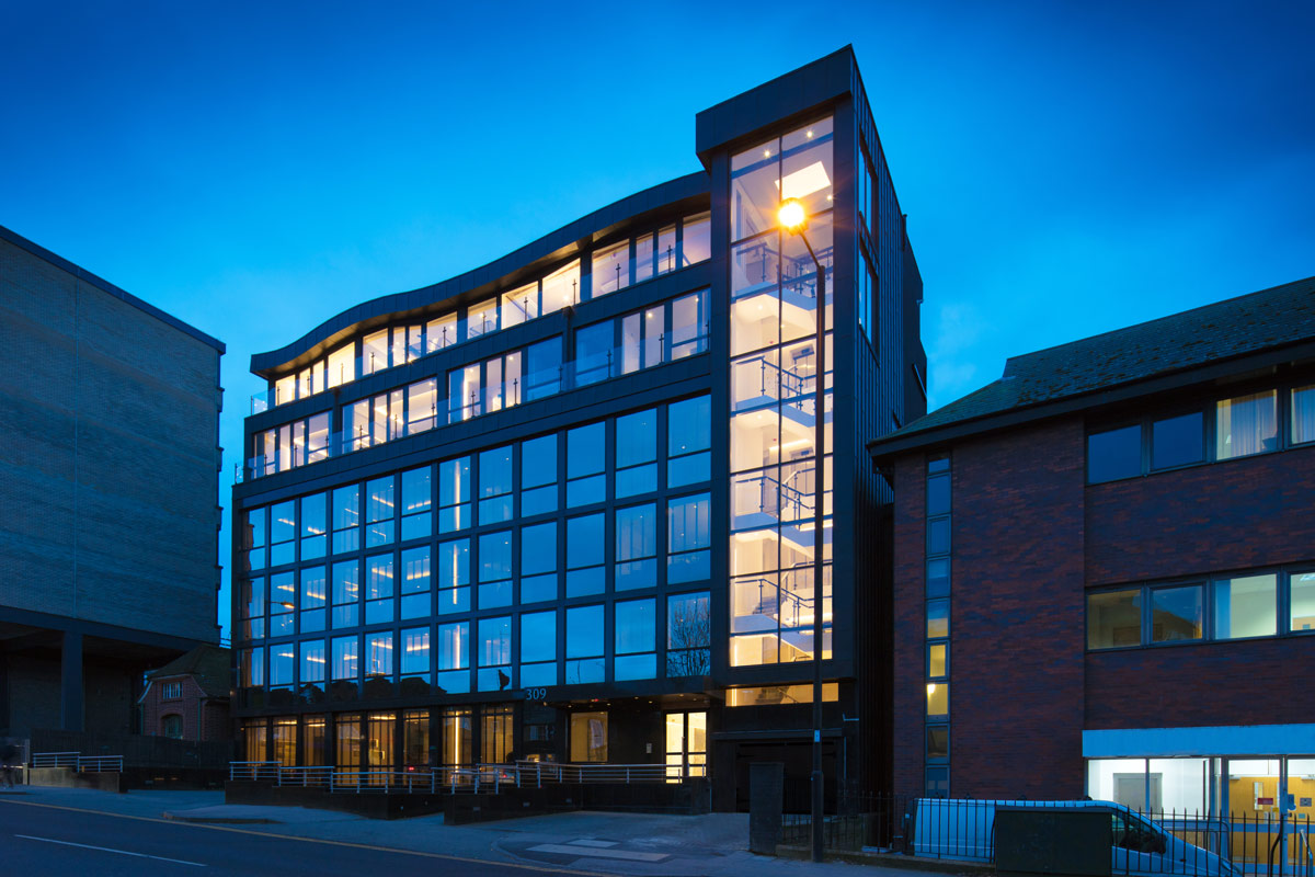 Newby House In Southgate With Lights On At Night
