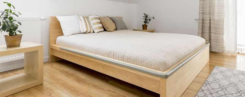 Large Bedroom With A Table And Bed