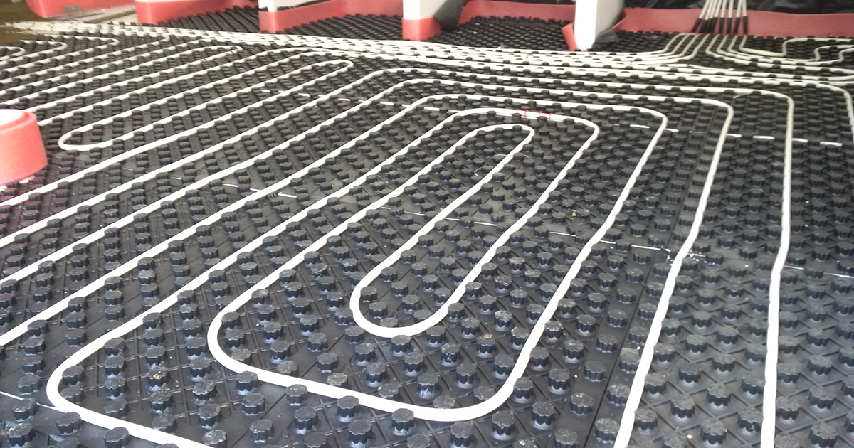 Hydronic underfloor heating being placed.