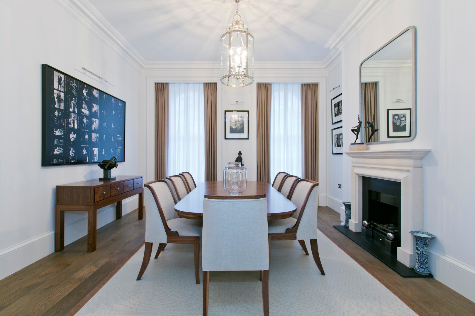 White Furnished Dining Room With Fireplace
